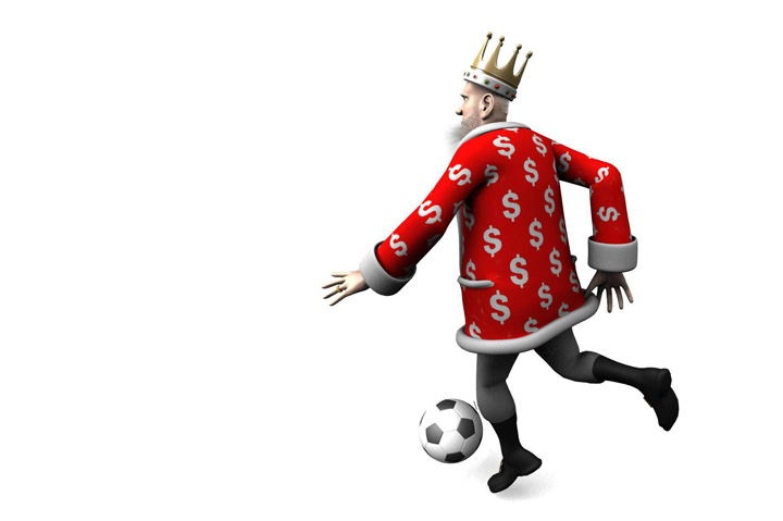 The King is performing a close-control move in the game of football.